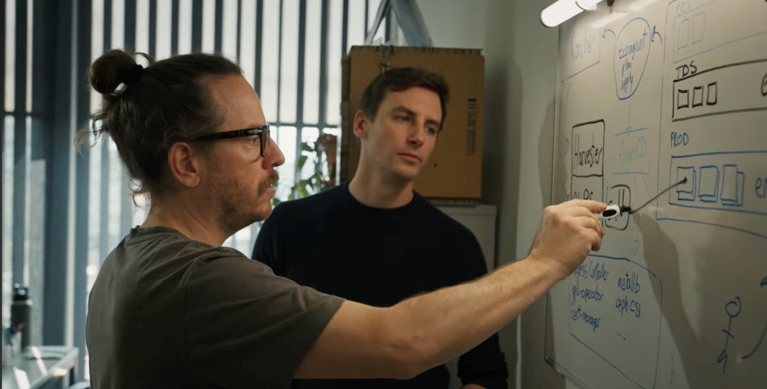 Screenshot of Dino Conciatore and Elia Oggian from CSCS, discussing in front of a white board